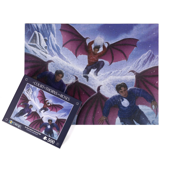 Completed puzzle of Rhys, Azriel, and Cassian having a snowball fight with the puzzle box with matching art for Bat Boys Solstice Snowball Fight A Court of Thorns and Roses 500 piece puzzle.