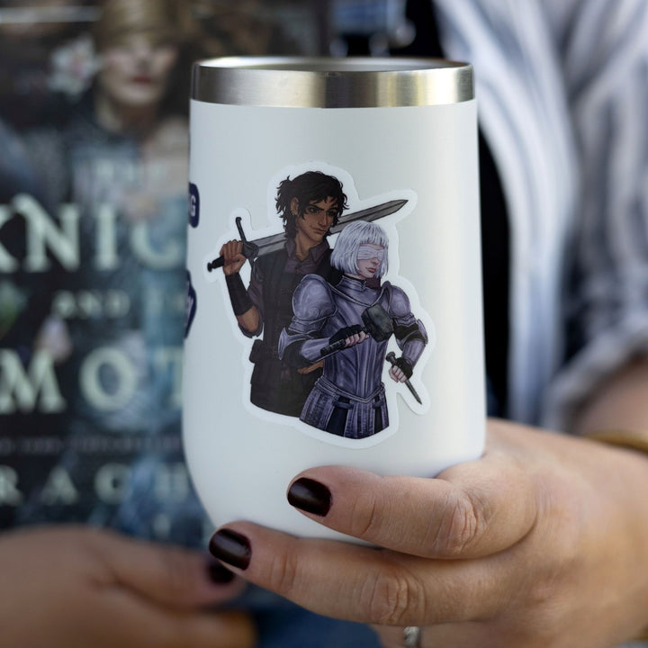 Sticker of Sybil from Knight & the Moth in armor, brandishing a hammer, with Rory, sword over his shoulder, on a white tumbler.