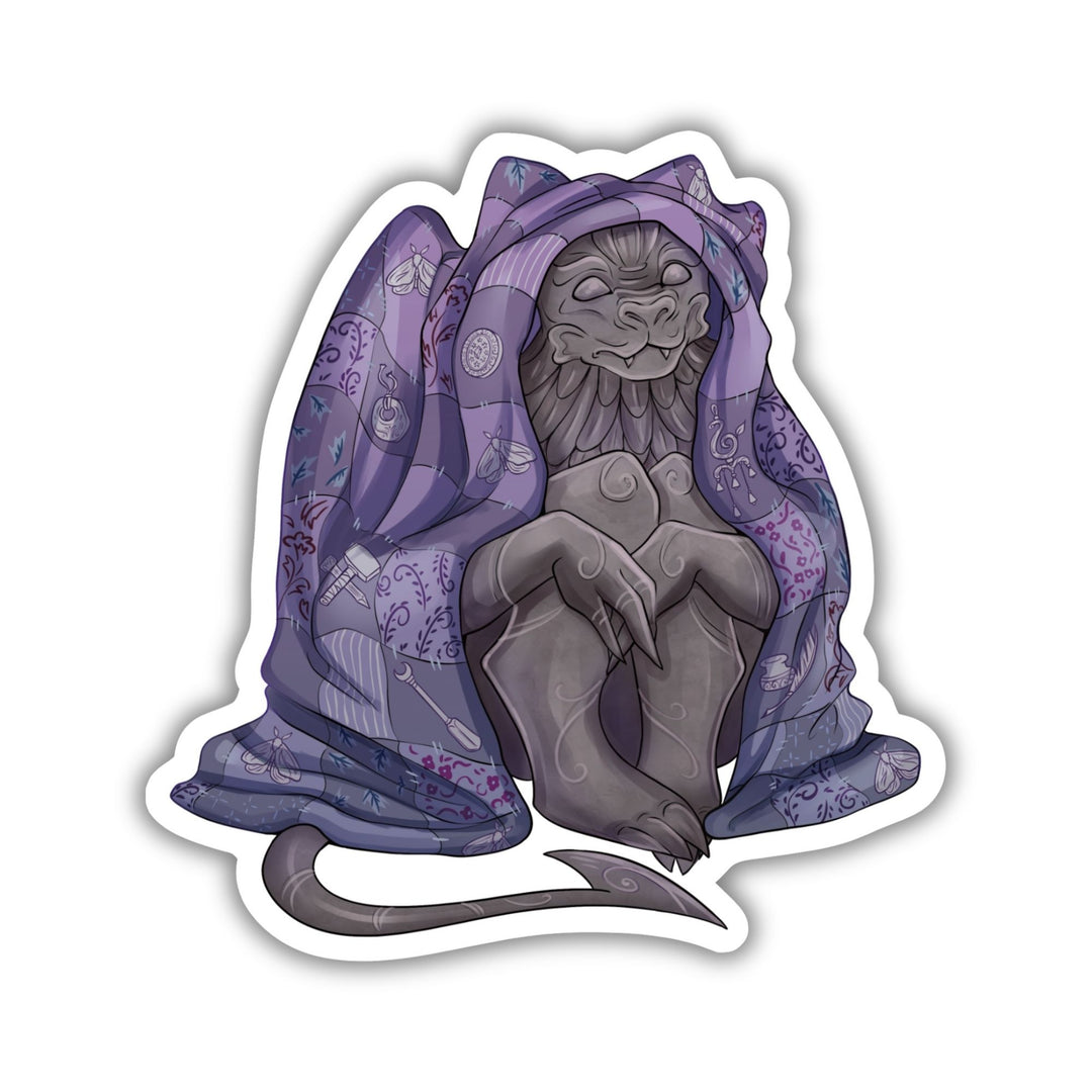 Sticker of a gargoyle sitting underneath a purple blanket. Character is Bartholomew from The Knight and the Moth by Rachel Gillig.