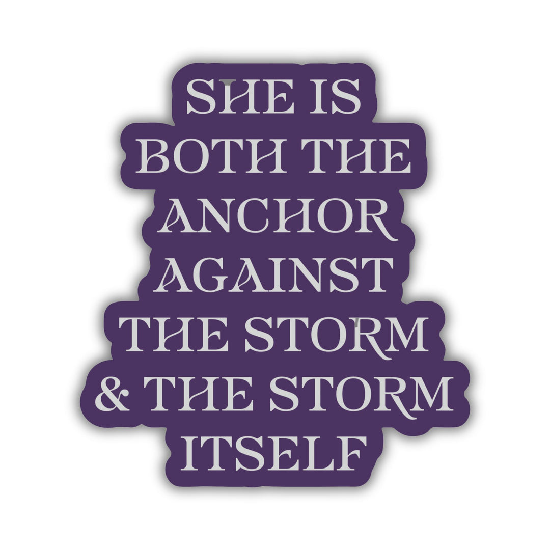 Red Queen quote sticker with silver text on a purple background. Text reads ‘She is both the anchor against the storm and the storm itself.’