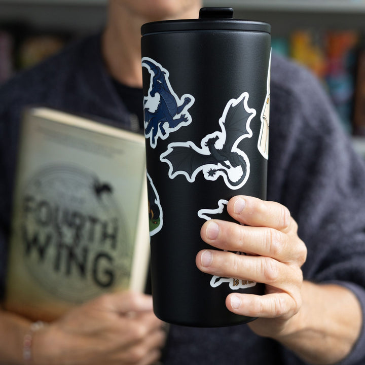 Sticker of Tairn, a magnificent black dragon & character from Fourth Wing, as a vinyl sticker. Sticker is on a black tumbler