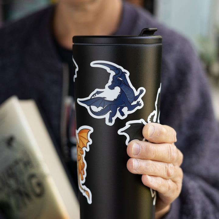 Sticker of Sgaeyl, a navy blue dragon & character from Fourth Wing, as a vinyl sticker. Sticker is on a black tumbler