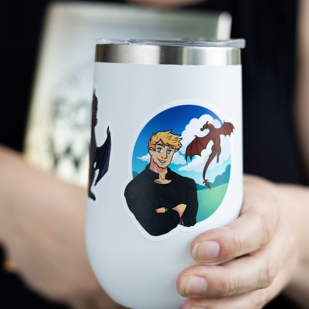  Sticker of Liam in black leathers with his red dragon Deigh lying behind him. Characters from Fourth Wing. On a white tumbler.
