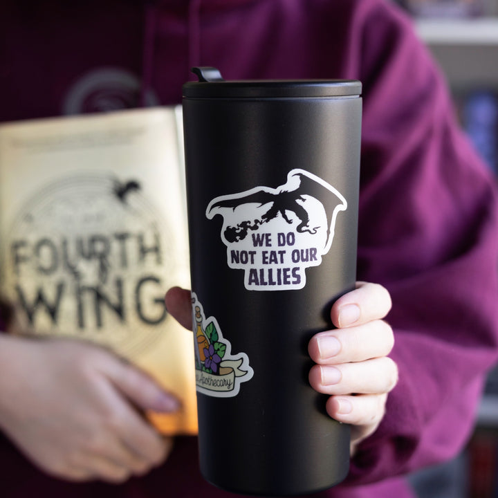 Sticker of a silhouette of a black dragon breathing fire. Below it reads ‘ We do not eat our allies. On a back tumbler.
