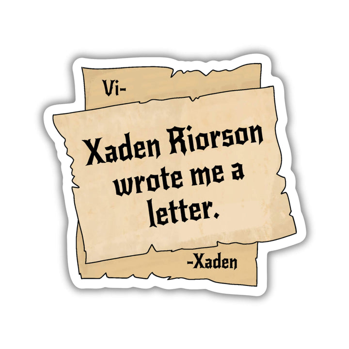 Sticker of parchment pieces. The corners of the bottom piece say “Vi- -Xaden’ with ‘Xaden Riorson wrote me a letter’ in the center.
