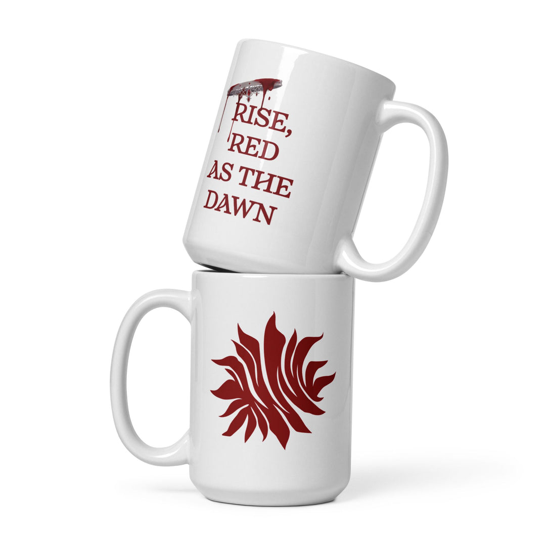 Two mugs stacked on top of one another. Bottom has the Scarlet Guard emblem from Red Queen by Victoria Aveyard. Top mug reads  ‘Rise Red As The Dawn’.