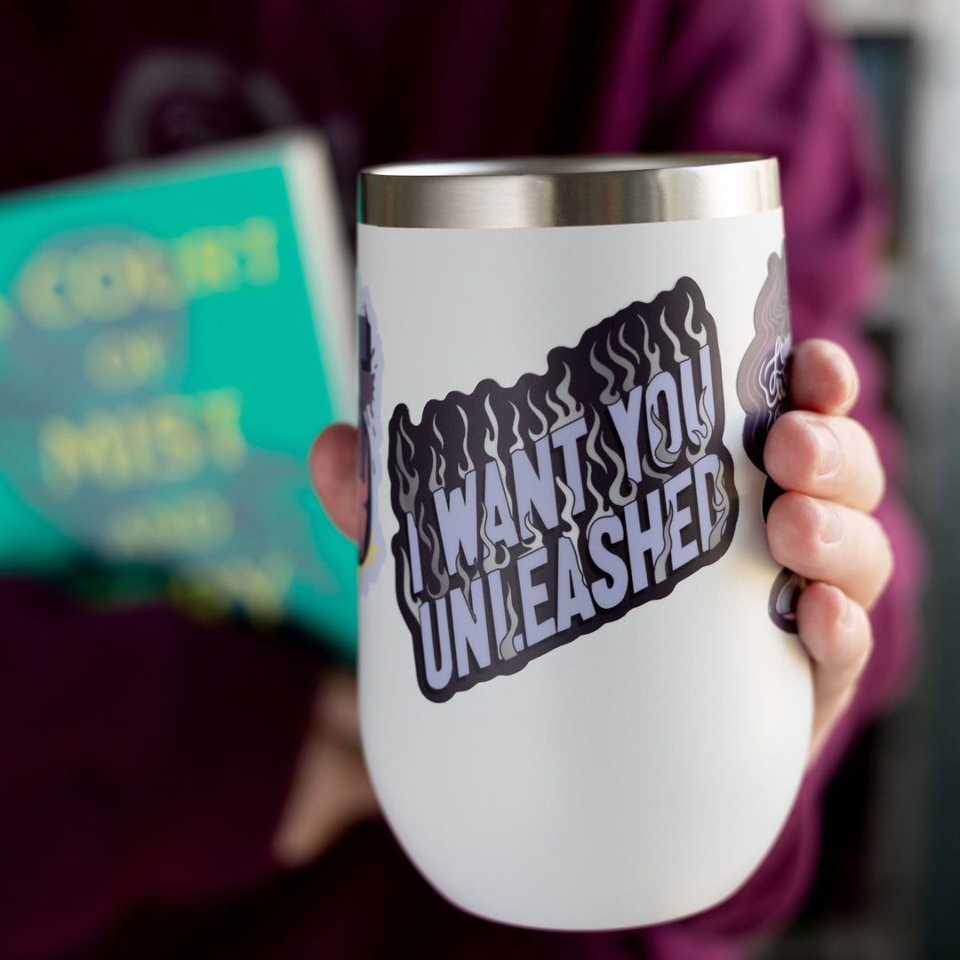 ACOTAR quote sticker ‘I want you unleashed’ in purple letters and silver flames. On a white tumbler.
