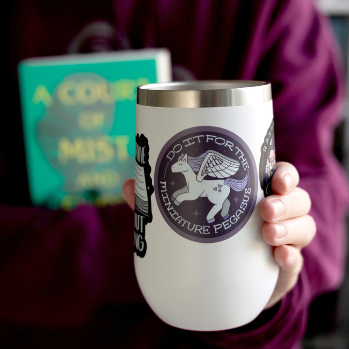  Sticker of a white and purple pegasus that says ‘Do it for the miniature pegasus around the circle. On a white tumbler.
