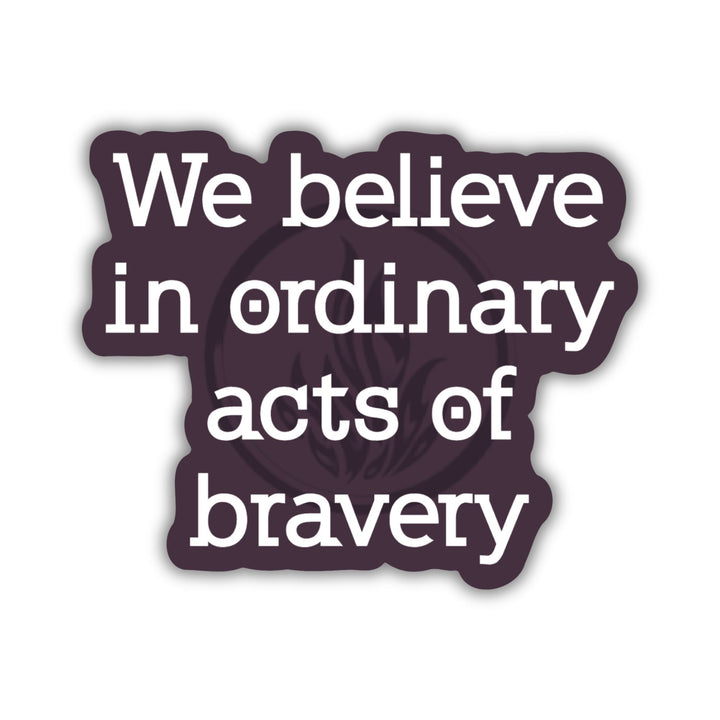 Divergent quote sticker in white text on a dark purple background. ‘We believe in ordinary acts of bravery.’ 
