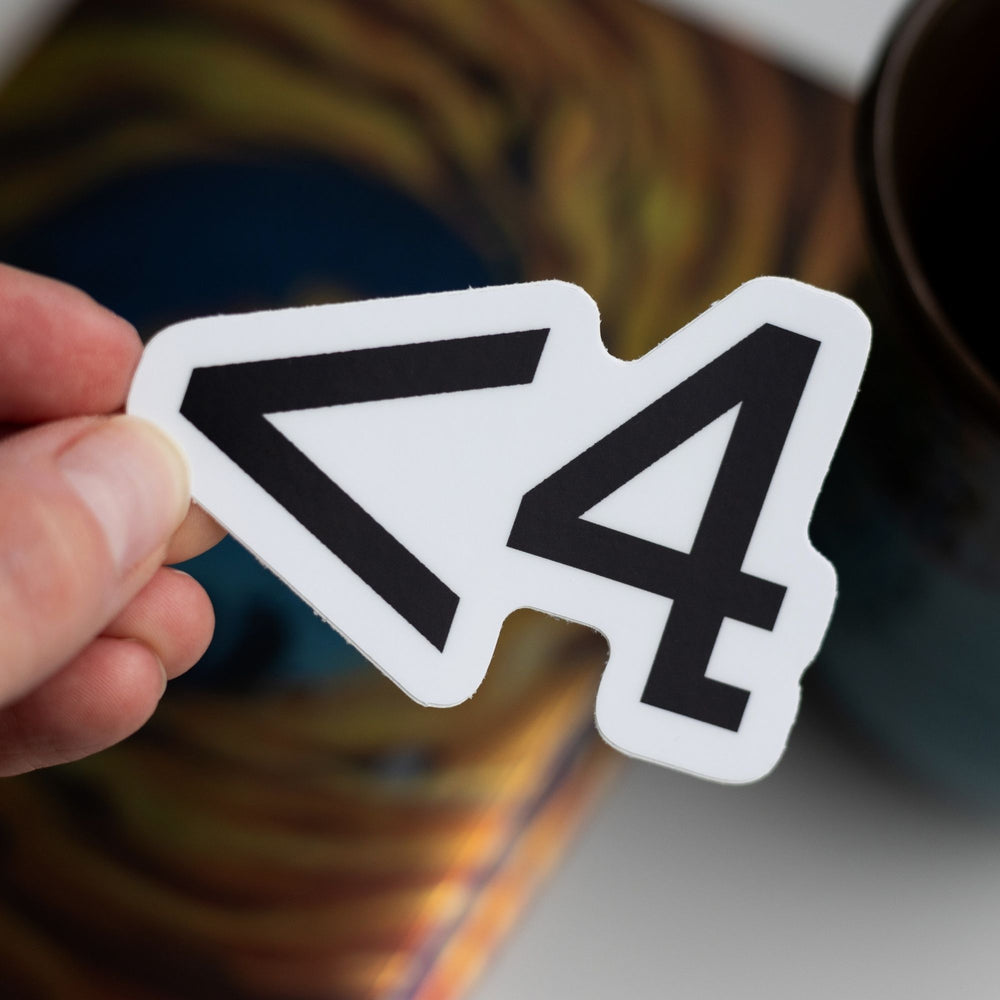 White sticker of the symbols < 4 in black held over Divergent by Veronica Roth.

